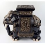 A large modern Chinese pottery jardiniÃ¨re stand in the form of elephant, with polychrome