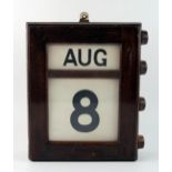 A mahogany cased wall perpetual calendar, with month and date panels, 29cm high.