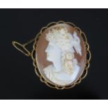 A 15ct Gold Mounted Shell Cameo Brooch decorated with the bust of a lady in profile, with safety