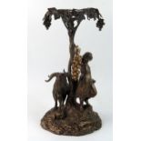 A late Victorian plated table centrepiece, depicting a maiden and goat below grape vines, on a