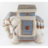 A large modern Chinese pottery jardiniÃ¨re stand in the form of elephant, with polychrome