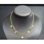 An Antique 9ct Gold and untested Pearl Fringe Necklace with five 11-9mm graduated suspended flower