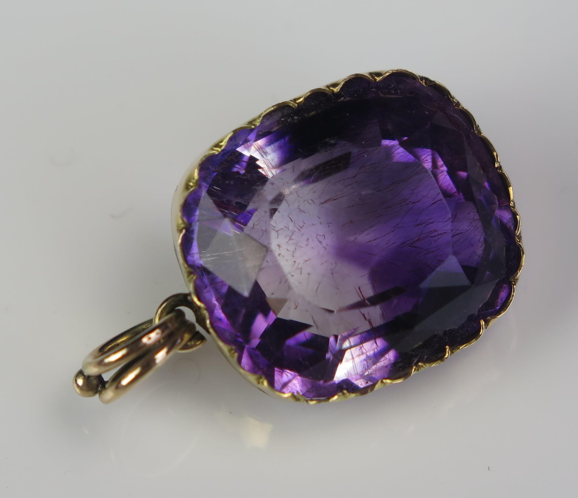 An Antique Amethyst Pendant in an unmarked gold setting, the 18.5x16.2mm stone with clear and purple - Image 5 of 6