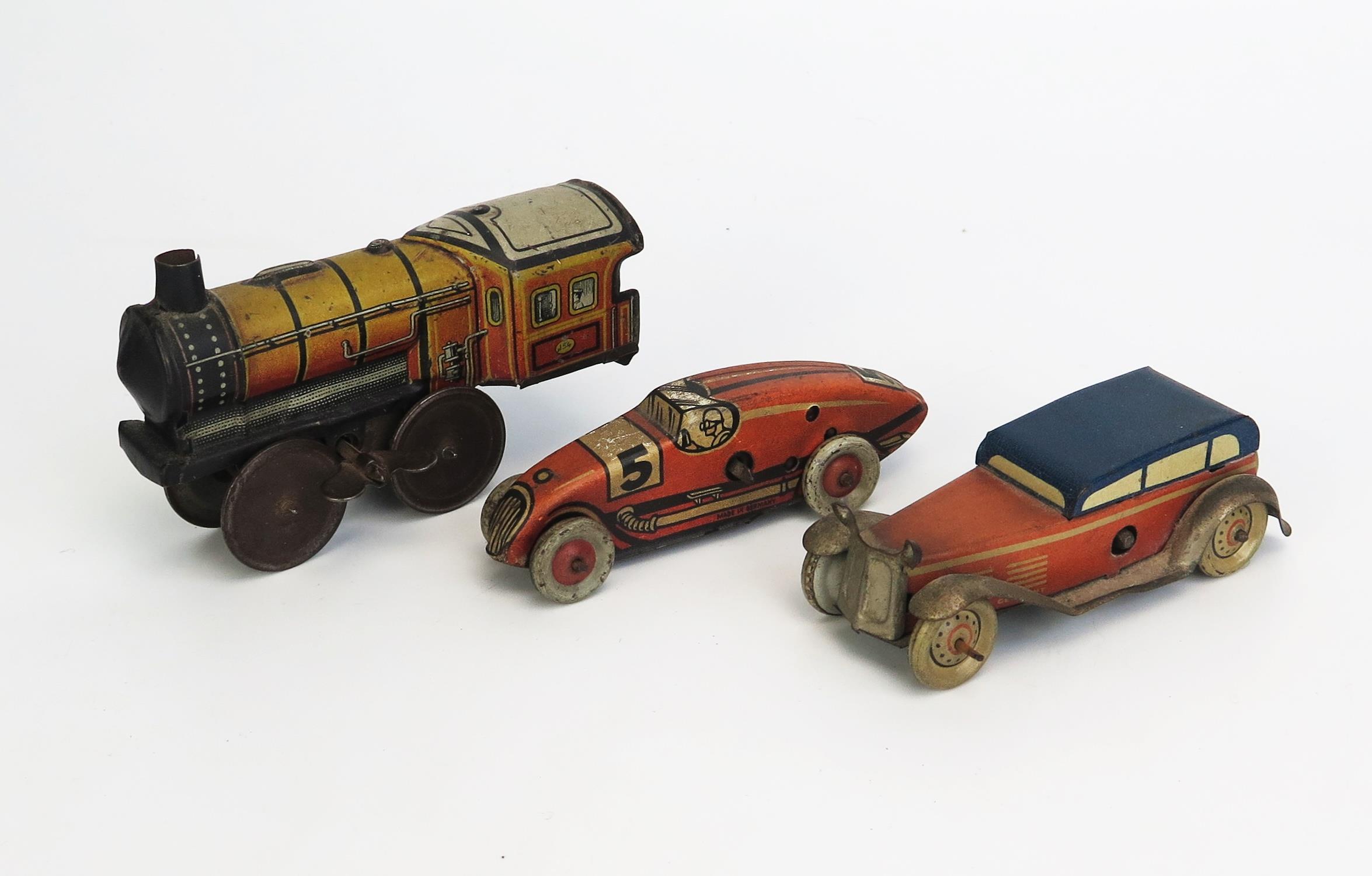 3 German Tinplate Clockwork Toys including car, racing car and train, possibly Tippco or Georg