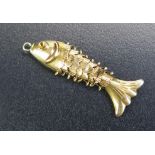 A 14K Gold Stamped Charm in the form of an articulated fish, 1.1g
