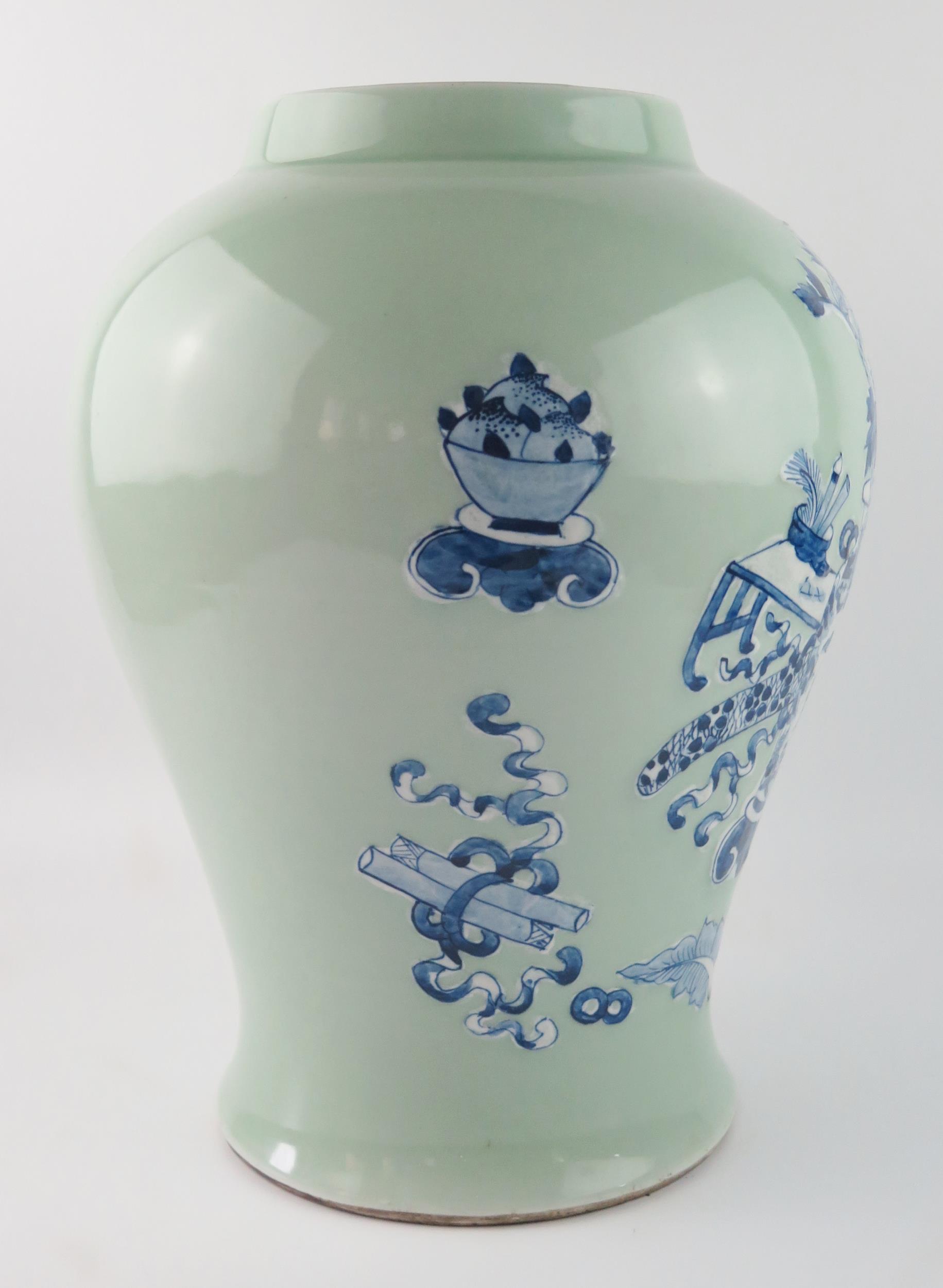 A Chinese vase of ovoid form, with blue and white auspicious objects to a green celadon ground, 37cm - Image 4 of 4