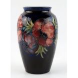 A Moorcroft pottery vase, "Poppies", of ovoid form, signed WM, 21cm high.