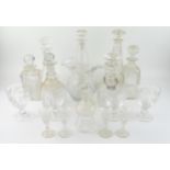 A collection of assorted cut glass wares, includes decanters, rummers, cordial jug, thistle-shaped