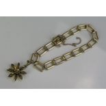 A 9ct Gold Bracelet with 9ct gold untested pearl set flower head pendant, 6.5" (17cm), 10.1g