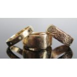 A Victorian 9ct Gold Buckle Ring (Birmingham 1862, maker WM, size Q, 4.4g), patterned wedding