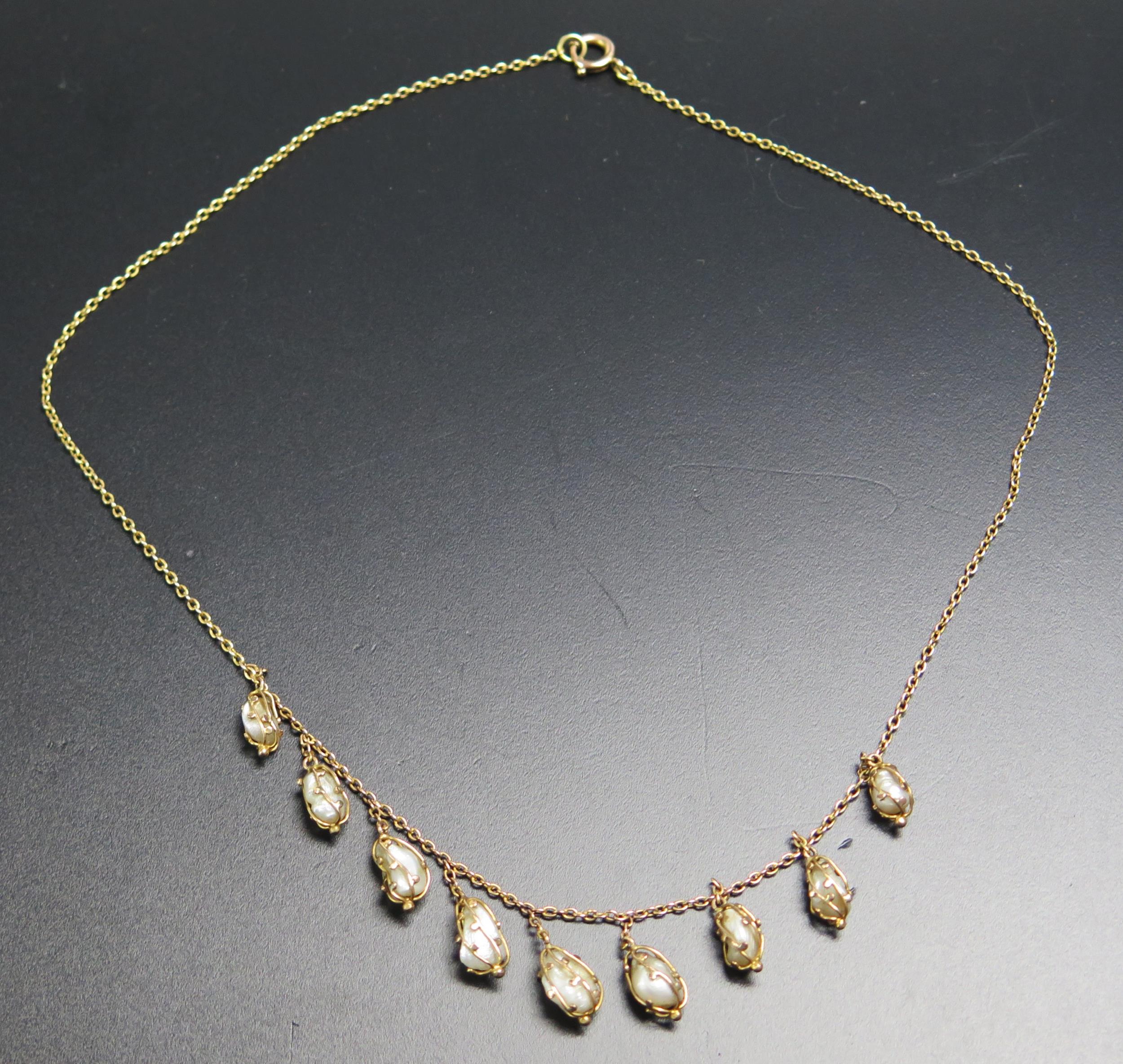 A 9ct Gold and untested Pearl Fringe Necklace with nine pearls ...