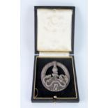 A replica Third Reich period Anti-Partisan Badge, contained in a fitted case.
