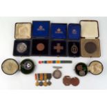 A World War One War Medal to Captain. R. EILLS, a group of four WWI miniatures, assorted silver,