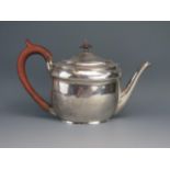 A George III silver oval teapot, maker William Bennett, London, 1804, crested, of plain design,