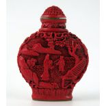 A Chinese faux cinnabar lacquer scent bottle, of moon-shaped outline decorated with figures in a