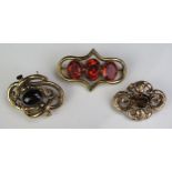 A Victorian Yellow Metal and Citrine? Brooch with chased foliate decoration (4x3cm, 5.2g), another