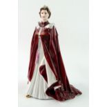 A Royal Worcester figurine, The queen in Robes of the Order of the British Empire,