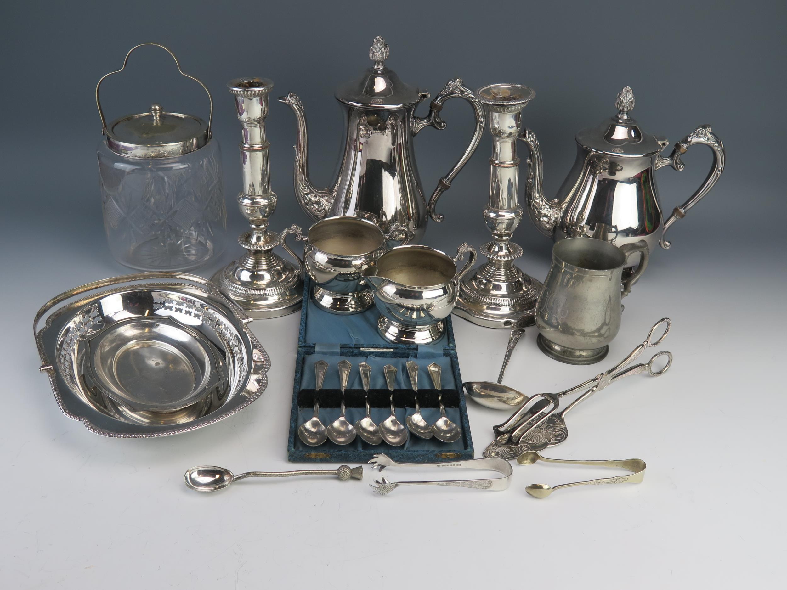 A plated four-piece tea and coffee service of ovoid outline, with foliate capped scroll handles, a