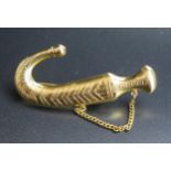 A Precious Yellow Metal Jalandhar Knife Brooch, unmarked, 51mm long, 8.6g. Bought in Aiden