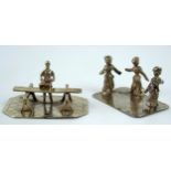 Two miniature silver figure groups, three dancing ladies on a rectangular base, and a cabinet