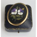 A 19th Century Pietra Dura Floral Decorated Brooch in a gilt metal setting, 47x39mm
