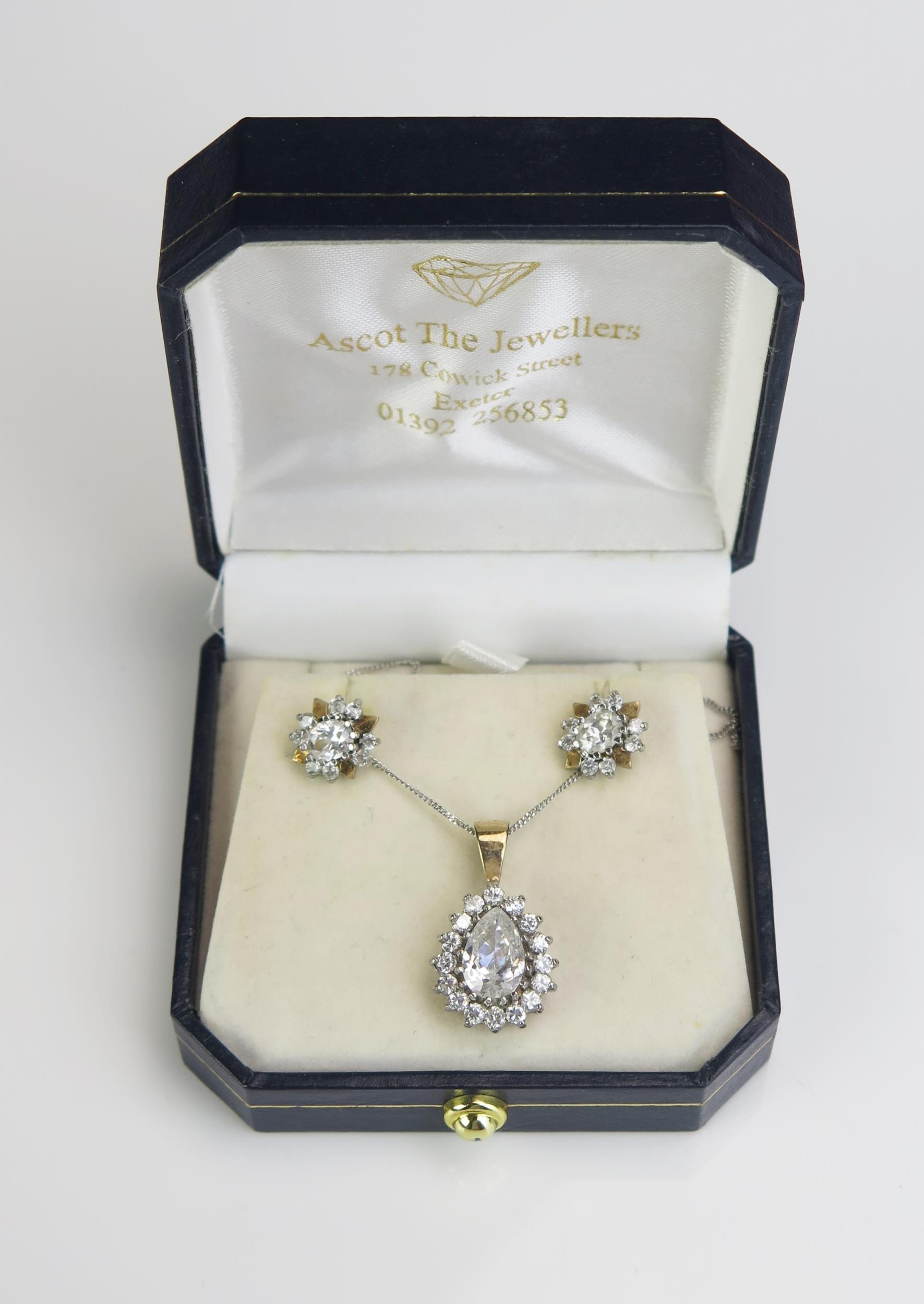 A 9ct Gold and Cubic Zircona Pendant and Earring Set, 21mm drop, on a 14ct gold 17.75" (45cm) chain,