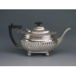 A George V silver teapot, maker Barker Brothers, Chester, 1918, of barge-shaped outline, with