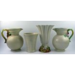 Clarice Cliff for Newport Pottery, two garden jugs, 23cm high, a fluted vase with moulded floral