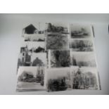 A collection of black and white reproduction photographs of bombing raids on Exeter showing damage