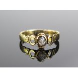 An Unmarked Gold and Hardstone Forget Me Not Ring, engraved inside C M Cookson, size L.5, 2.6g.