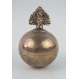 A Victorian white metal table cigar lighter in the form of a flaming grenade, inscribed and dated