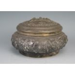 A Burmese silver circular bowl and cover , decorated all over with figures seated in interiors,