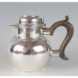 An Edward VII silver hot water jug, maker Charles Stuart Harris, London, 1903, of globular form with
