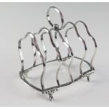 A Victorian silver four-division toast rack, maker Hilliard & Thomason, Birmingham, 1897, of