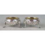 A pair of George III silve circular salts, maker SM, London, 1770, with floral banded decoration,