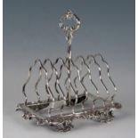A Victorian silver six-division toast rack, maker Martin, Hall & Co, Sheffield, 1857, monogrammed,