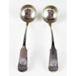 A pair of Victorian Scottish silver sauce ladles, maker William Clarke Shaw, Glasgow, 1859, crested,