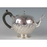 A Victorian silver teapot, maker Charles Stuart Harris, London, 1886, of globular circular for, with