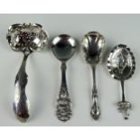 Four assorted continental silver sifting and preserve spoons, of varying designs, total weight of