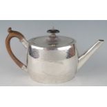 A George III silver oval teapot, maker's mark worn. London, 1788, with banded stellar decoration,