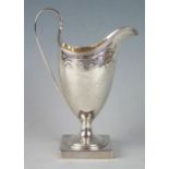 A George III silver cream jug maker Peter & Ann Bateman, London, 1793, monogrammed, of helmet-shaped