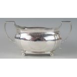 A George III silver twin-handled sugar basin, maker Charles Fox I, London, 1807, of barge-shaped