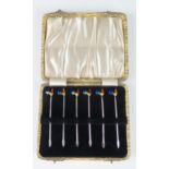 A set of six sterling silver and enamel cocktail sticks, the terminals in the form of cockerels,