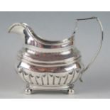 A George III silver barge-shaped cream jug, maker possibly Peter & William Bateman, London, 1813,