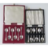Two sets of six silver coffee spoons, contained in fitted cases, total weight of silver 105gms, 3.