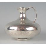 A continental silver jug, stamped marks of squat circlalr form, with narrow neck and curved