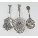Three large continental silver spoons, stamped mraks, with embossed and pierced decoration,
