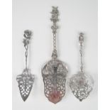 Three continental silver slices with pierced blades ajd decorative handles, total weight of silver