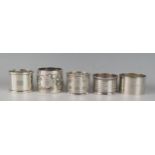 A collection of five assorted silver napkin rings, various makers and dates, total weight of silver,