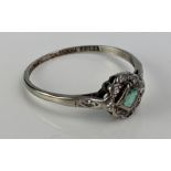 An Emerald and Old Cut Diamond Ring in an 18ct white gold and platinum setting, early 20th